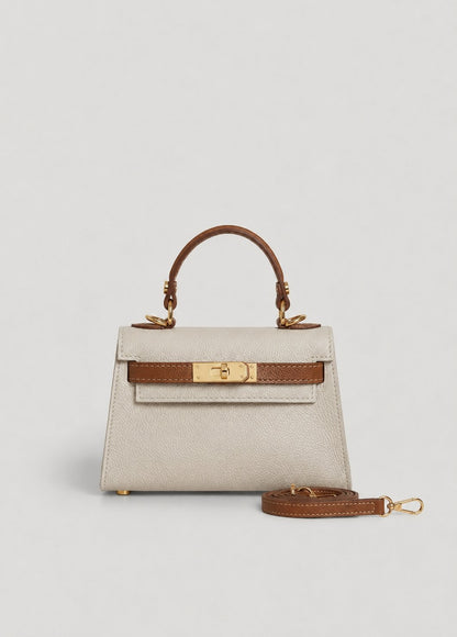 Poșetă damă bicolor crem și camel din piele naturală întoarsă premium, Made in Italy, cu închidere twist-lock aurie și curea reglabilă și detașabilă. Geantă elegantă pentru femei, ideală pentru ținute office, casual chic, evenimente, petreceri și utilizare zilnică.