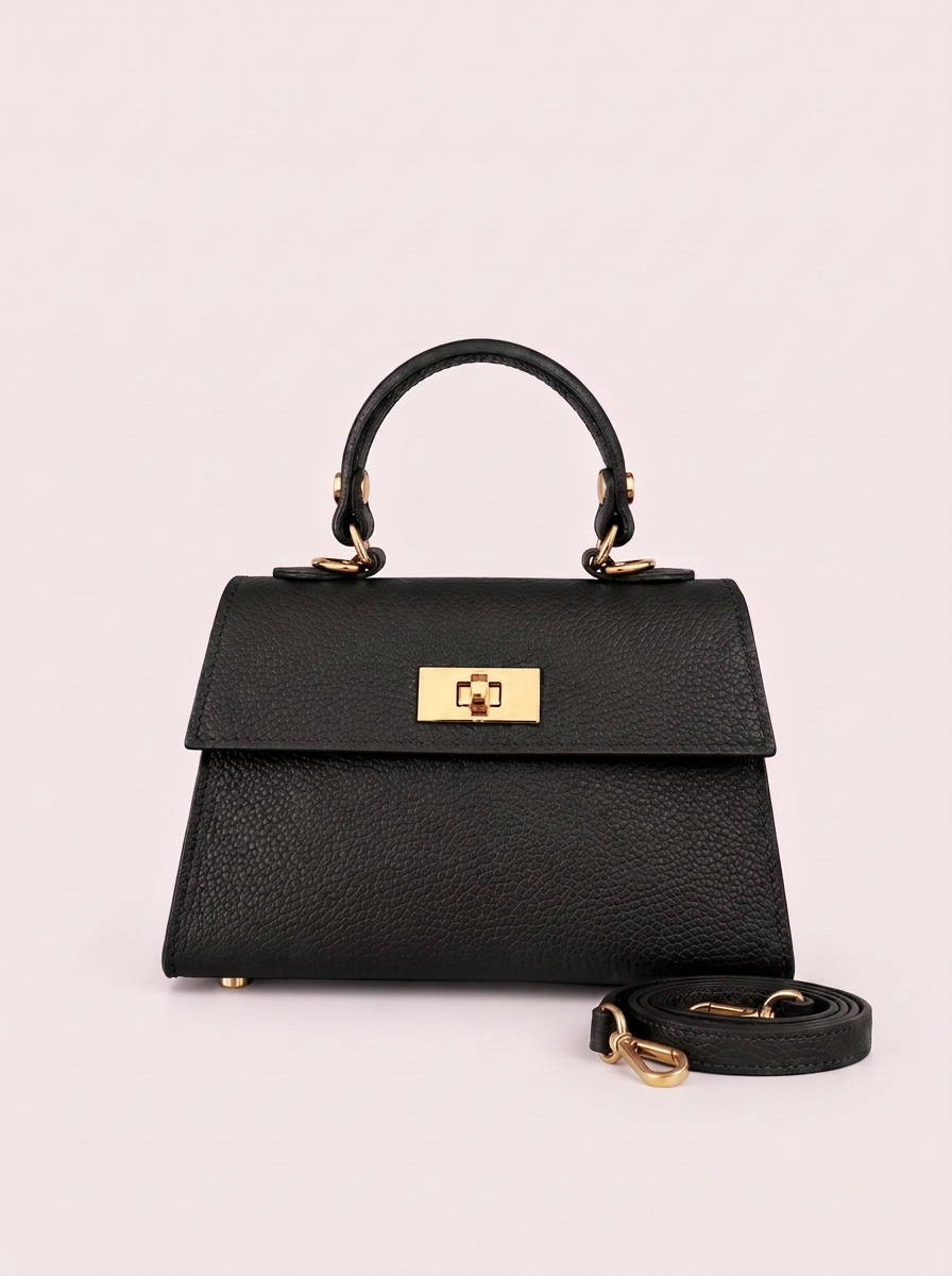 Geantă damă neagră din piele naturală italiană, cu design structurat, închidere metalică aurie și curea pentru purtare pe umăr sau crossbody. Poșetă compactă și elegantă, ideală pentru oraș, birou, întâlniri și ținute casual chic.