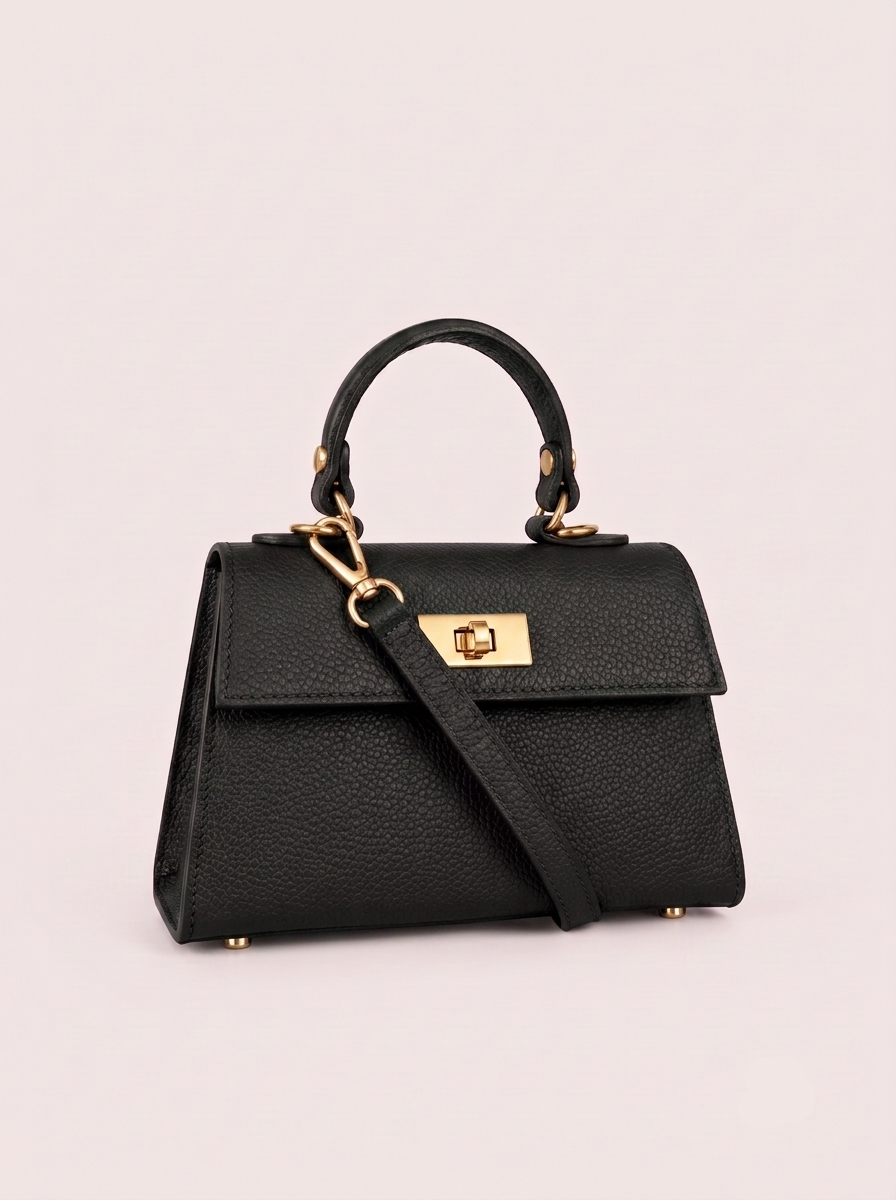 Poșetă Emilia mică neagră pentru femei, realizată din piele naturală premium, cu mâner rigid, detalii aurii și compartiment interior practic. Geantă Made in Italy pentru outfituri elegante, moderne, business și ocazii speciale.