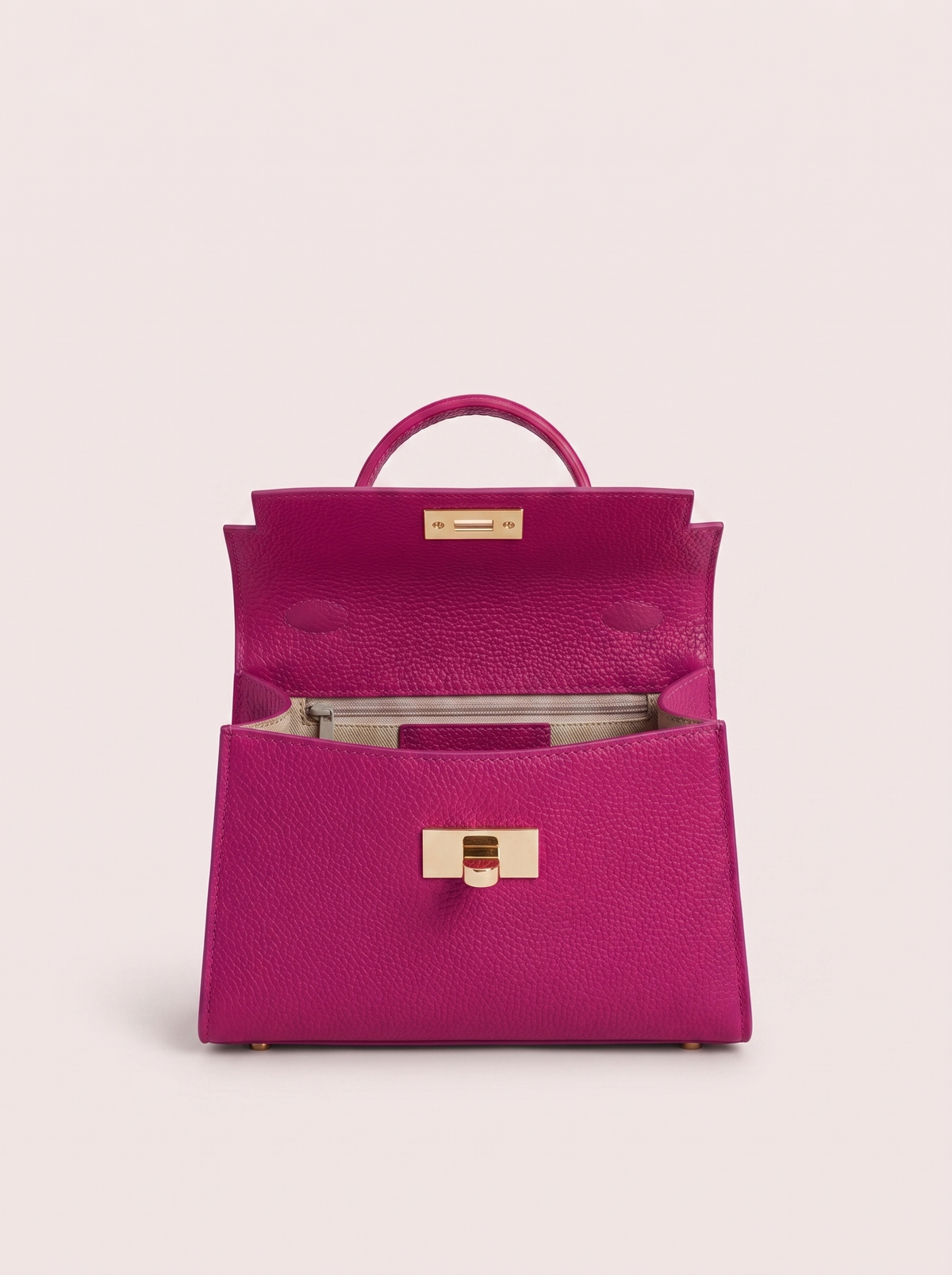 Poșetă elegantă fucsia din piele naturală premium pentru femei, cu finisaje de înaltă calitate, accesorii aurii și design structurat, potrivită pentru ținute office, casual elegante și evenimente festive