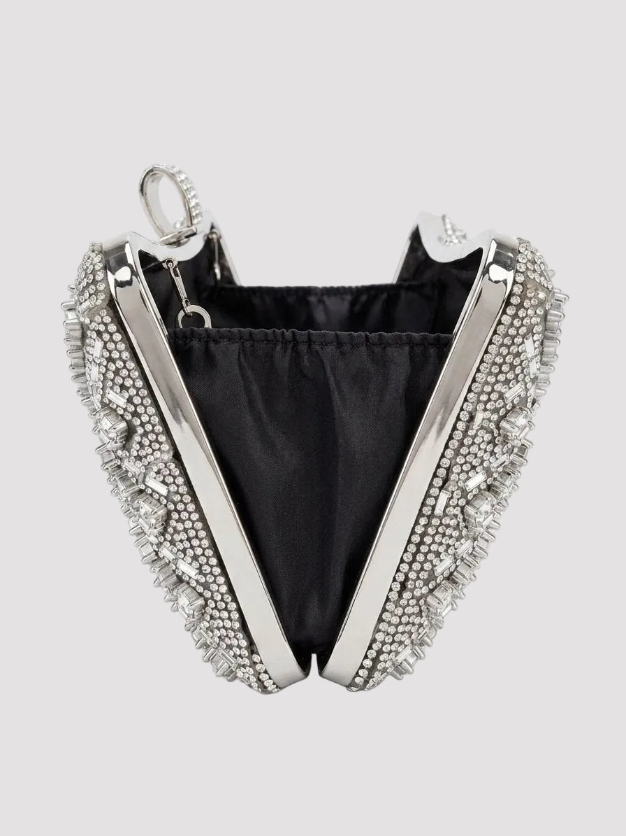 Geantă elegantă tip clutch argintie cu cristale premium, lanț metalic detașabil și închidere sigură tip clasp, accesoriu feminin sofisticat pentru ținute de gală, rochii elegante și evenimente speciale unde fiecare detaliu contează.