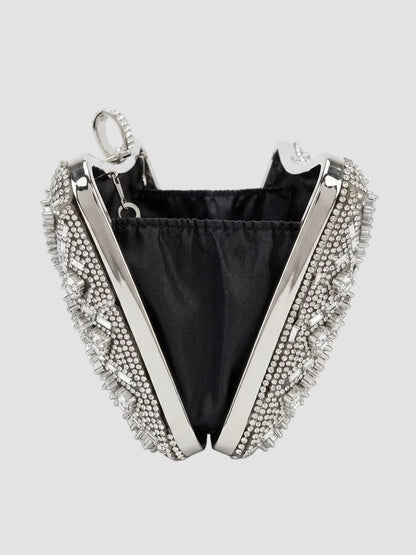 Geantă elegantă tip clutch argintie cu cristale premium, lanț metalic detașabil și închidere sigură tip clasp, accesoriu feminin sofisticat pentru ținute de gală, rochii elegante și evenimente speciale unde fiecare detaliu contează.