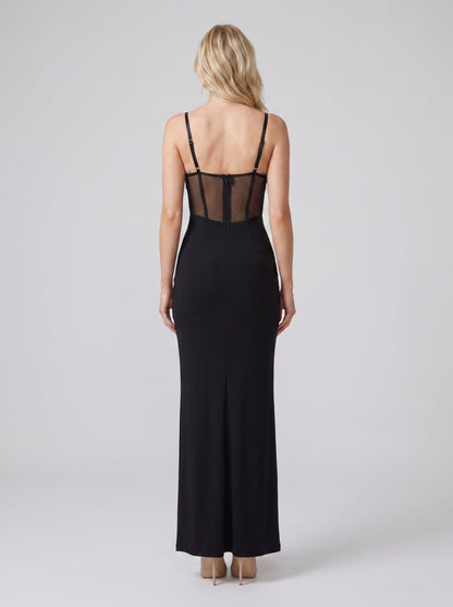 Rochie de seară neagră pentru femei, cu aplicații strălucitoare din cristale, inserții transparente și croială maxi care pune în valoare armonios silueta. Rochie elegantă premium pentru damă, potrivită pentru gale, petreceri exclusiviste, recepții și ocazii speciale.